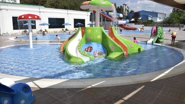 A water park with slides and a pool.