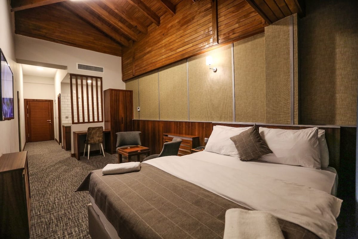 Suite, Balcony, Sea View | 1 bedroom, in-room safe, laptop workspace, iron/ironing board