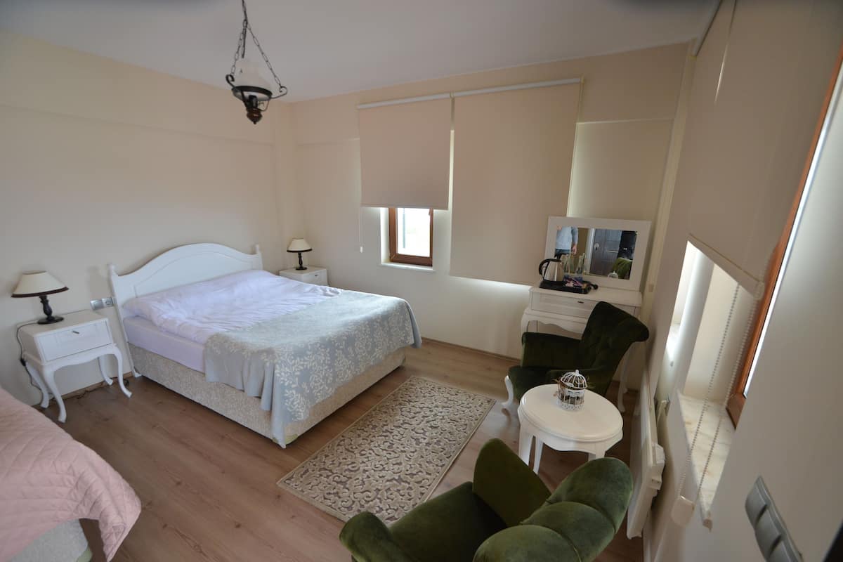 Junior Triple Room, Sea View | 1 bedroom, in-room safe, laptop workspace, iron/ironing board