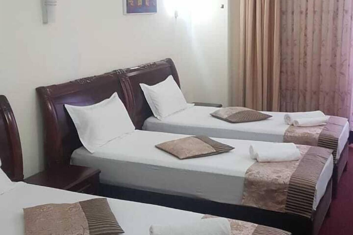 Basic Triple Room, Multiple Beds, Non Smoking | In-room safe, rollaway beds (surcharge), WiFi (free), bed sheets