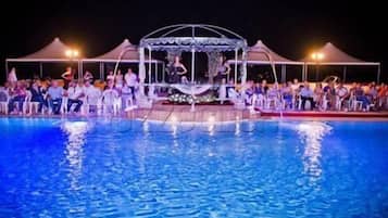 Seasonal outdoor pool, open 6:00 AM to 6:00 PM, pool umbrellas