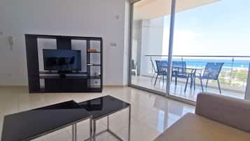 Departamento, 1 habitación | Área de sala de estar | Televisión de pantalla plana