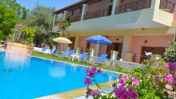 Seasonal outdoor pool, pool umbrellas, sun loungers