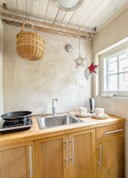 Deluxe Room | Private kitchenette | Coffee/tea maker, microwave, stovetop, cookware/dishes/utensils