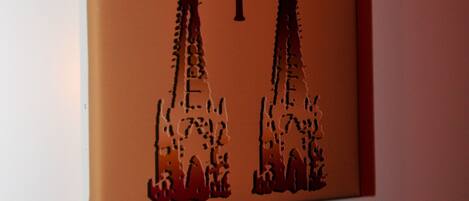 A wall-mounted sign with a number '1' and a silhouette of two towers.