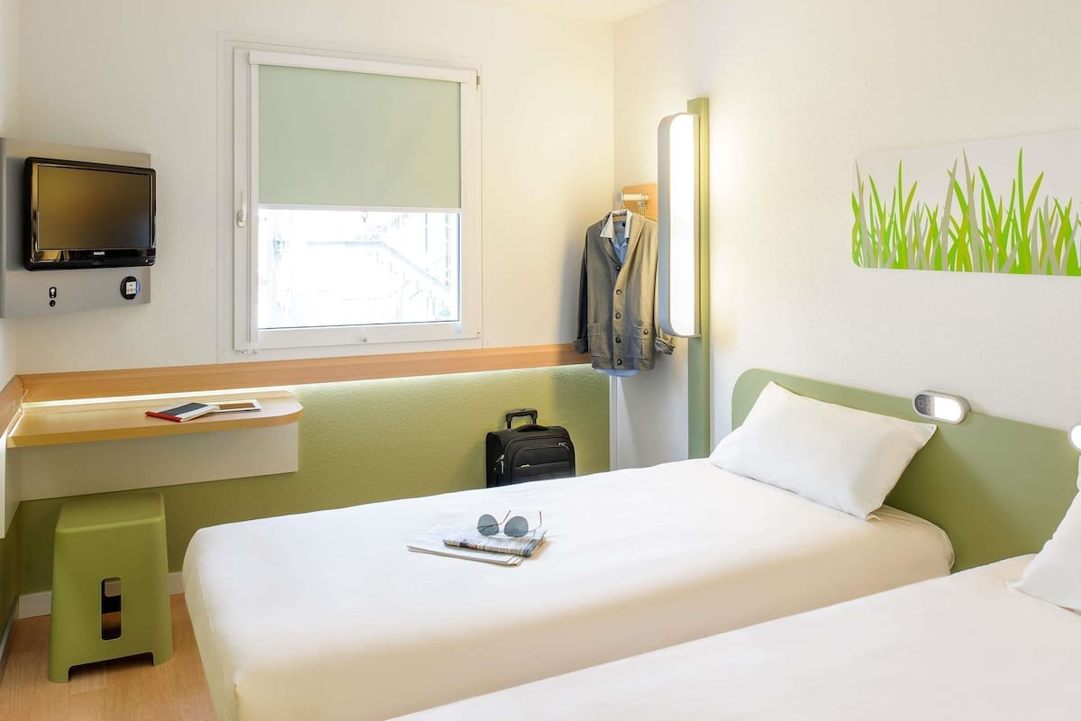 Standaard appartement, 2 eenpersoonsbedden | Een minibar, een kluis op de kamer, een bureau, gratis wifi