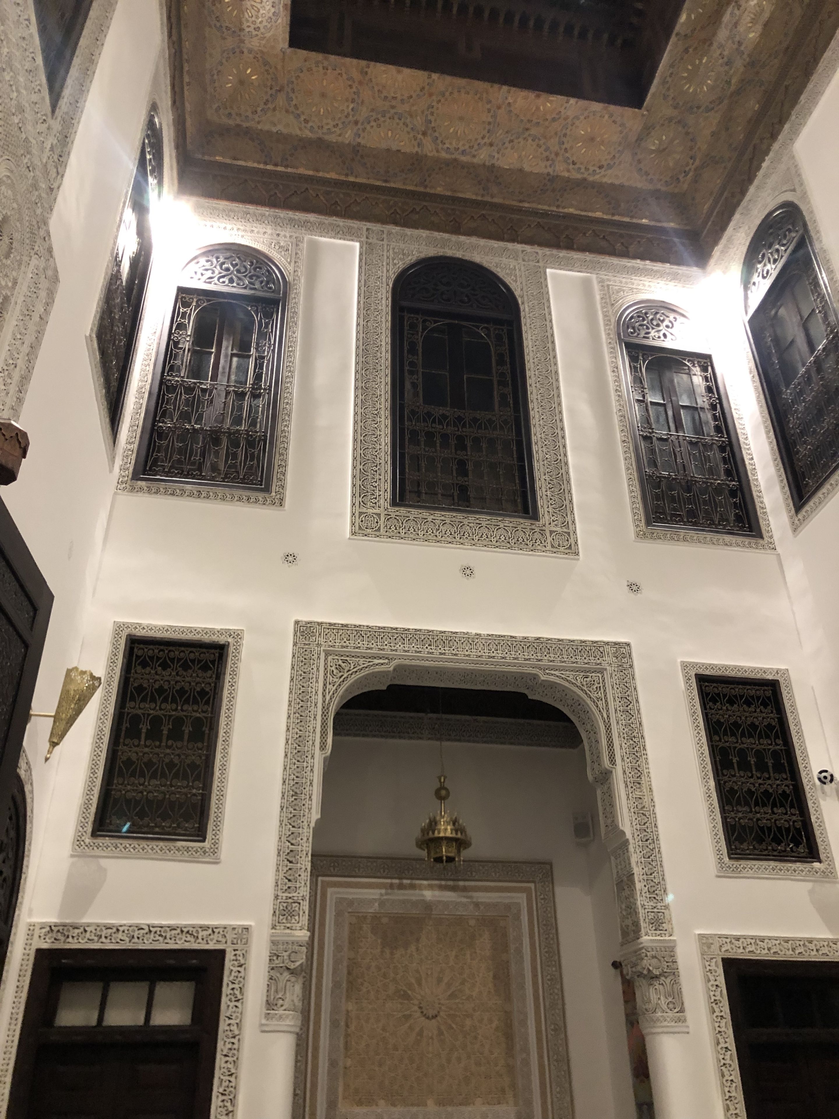 A multi-level building with ornate architectural details, including intricate window designs and decorative arches.