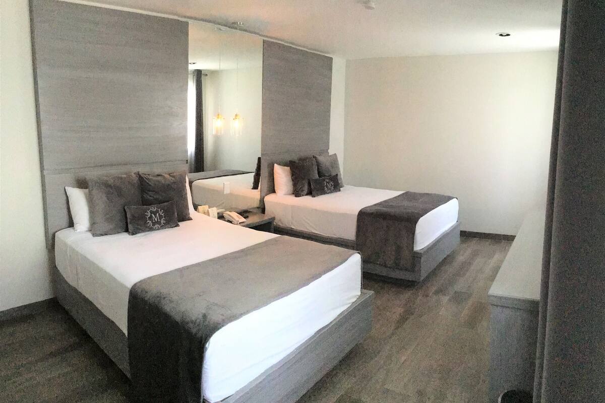 Standard Double Room | Minibar, in-room safe, desk, blackout drapes