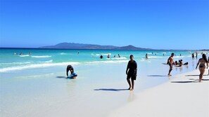 Beach nearby, white sand, sun loungers, beach umbrellas