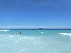 Beach nearby, white sand, sun loungers, beach umbrellas