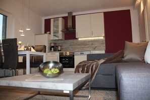 Appartement Deluxe, 1 très grand lit (incl. cleaning fee) | Aire de séjour | Téléviseur à DEL