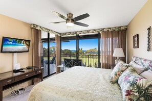 Master bedroom has beautiful golf course and ocean views. The bedroom is equipped with a king bed.