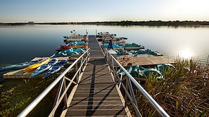 Guests can enjoy a serene lakeside experience with access to the water via the pier.
