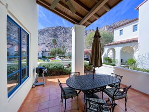 Enjoy al fresco dining on the patio with a grill and seating for four.
