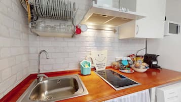 Fridge, coffee/tea maker, toaster, cookware/dishes/utensils