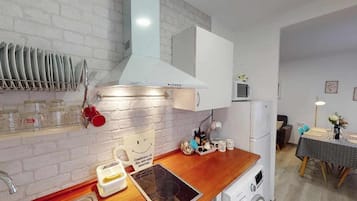 Fridge, coffee/tea maker, toaster, cookware/dishes/utensils