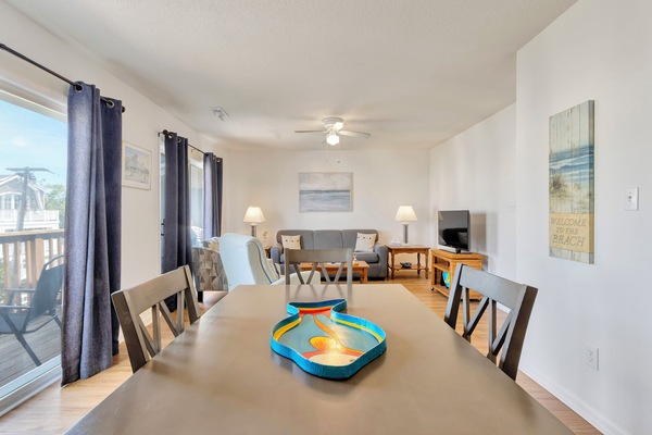 Open living area with dining table for 4 and great views from balcony sliders