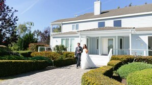 A two-story building with a covered walkway and a garden. - Perfect For Large Family Get Aways Or Your Gorgeous Ranch Style Wedding. (Arroyo Grande)