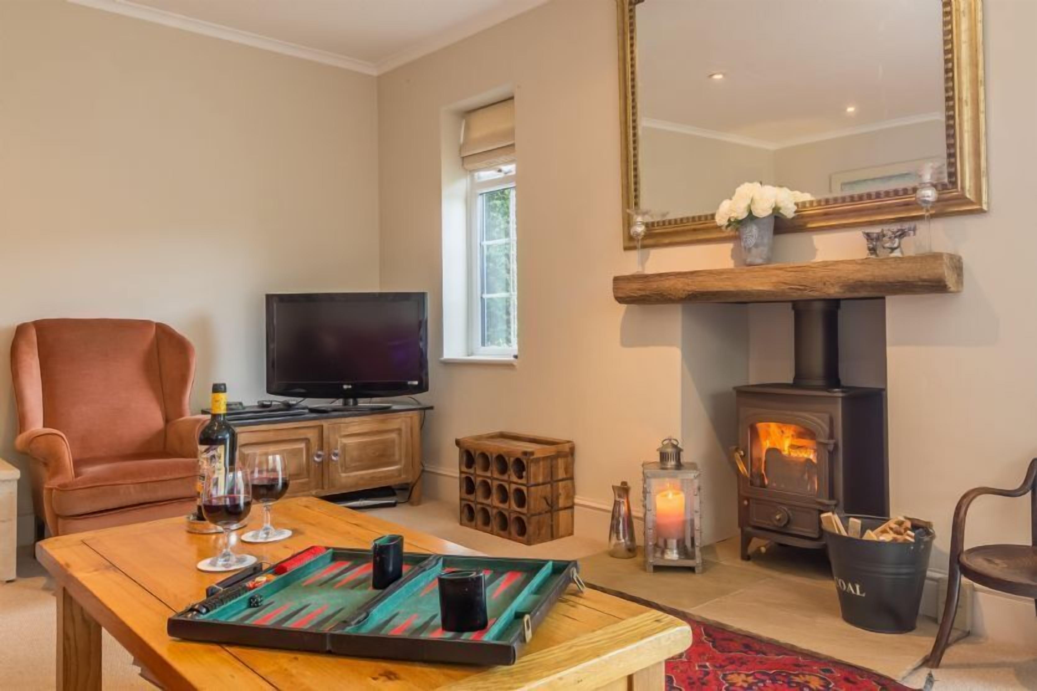 Ground floor: Sitting room has a cosy wood burning stove