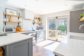 Microwave, dishwasher, highchair, dining tables