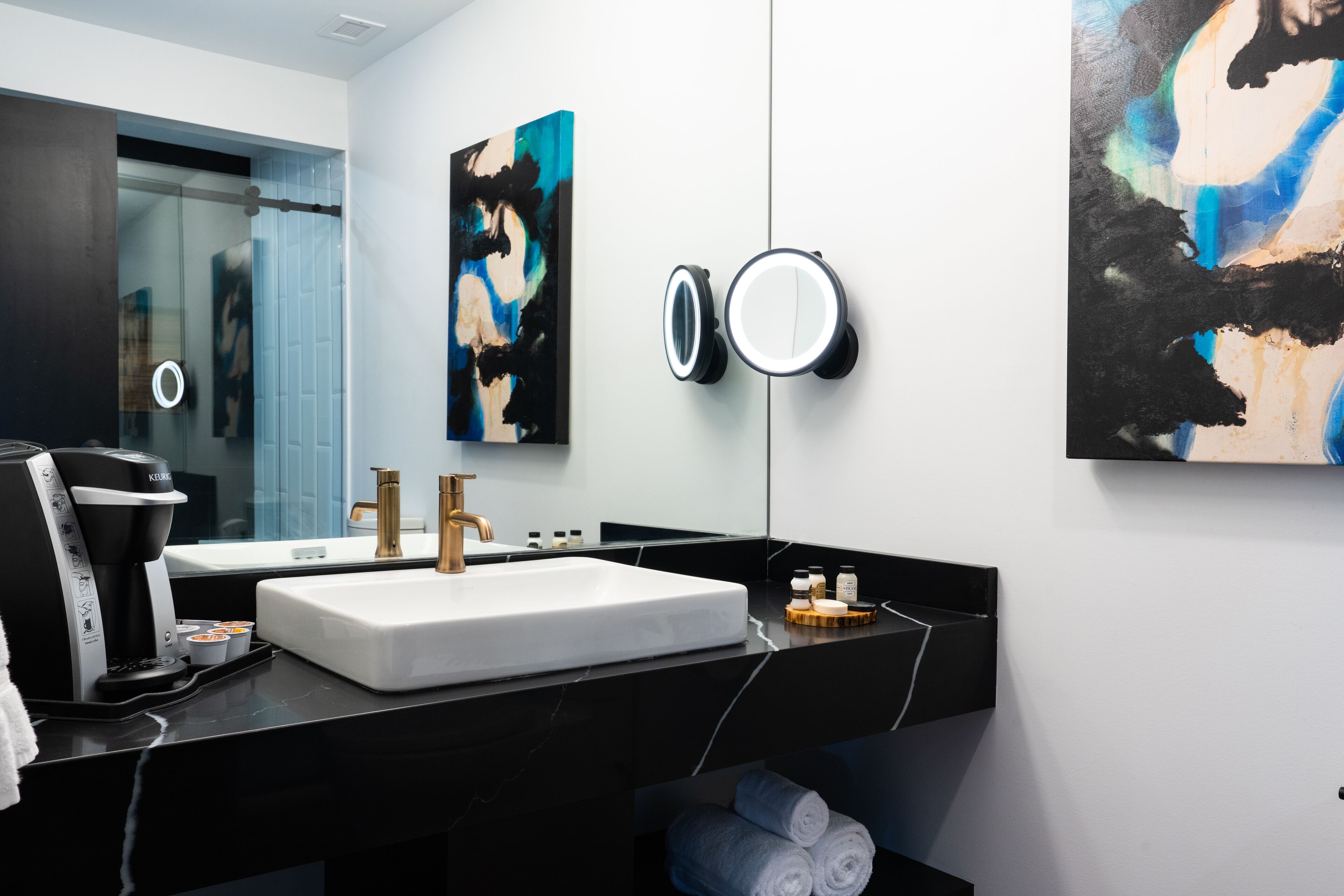 designer toiletries, hair dryer, bathrobes, towels