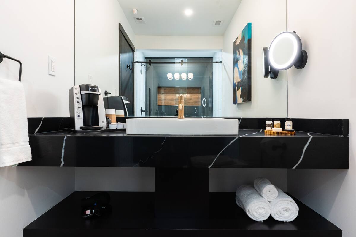 designer toiletries, hair dryer, bathrobes, towels