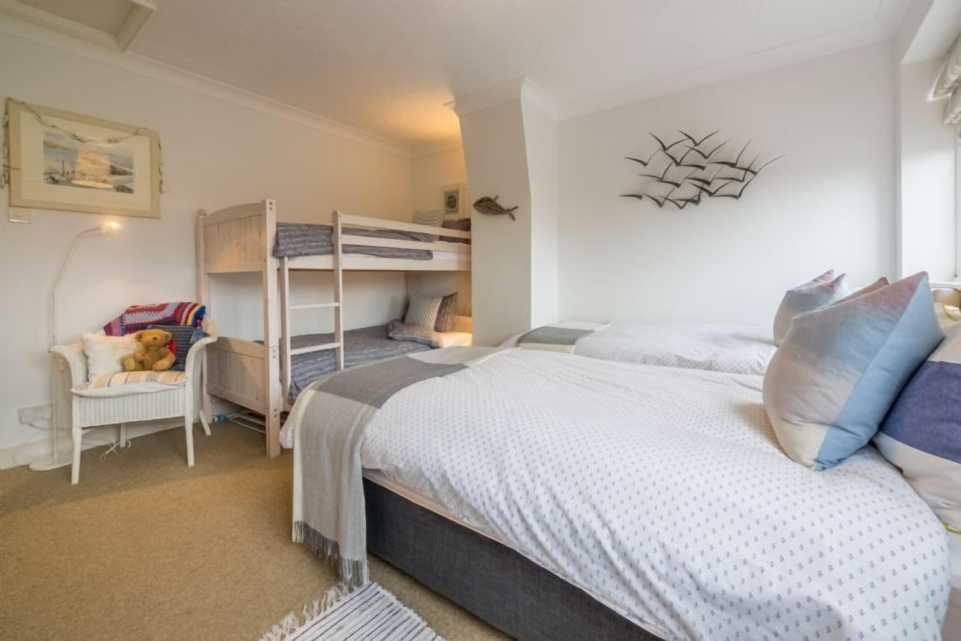 First floor:  Bedroom two has twin beds and bunk bed