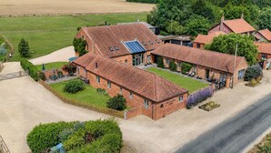 A large brick house with multiple rooms, a driveway, and a surrounding garden. - The Cart Lodge, Great Massingham, Norfolk (King's Lynn)