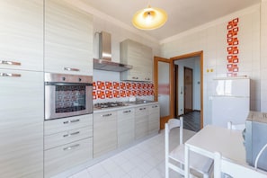 Fridge, oven, coffee/tea maker, cookware/dishes/utensils