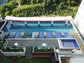 Seasonal outdoor pool, open 8:00 AM to 8:00 PM, sun loungers