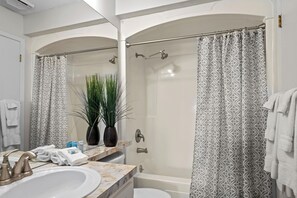 Combined shower/tub, towels, soap, shampoo