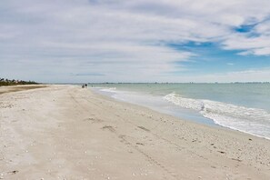 On the beach, sun-loungers, beach towels