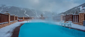 Outdoor pool, free wifi, free parking at building, ski in-center village.
