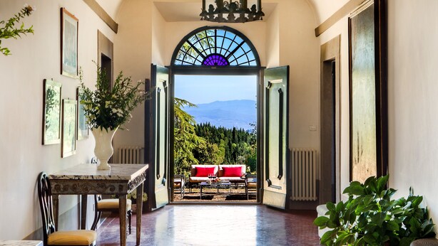 A hallway leading to a seating area with a view of the outdoors. - Exclusive 7BR-8BA Villa with pool, a few mins from town, yet in the countryside (Impruneta)