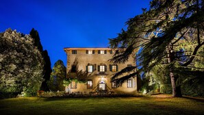 A large, historic building with a symmetrical facade, multiple windows, and a central entrance. - Exclusive 7BR-8BA Villa with pool, a few mins from town, yet in the countryside (Impruneta)