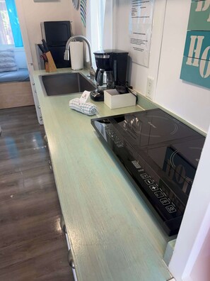 Fridge, microwave, stovetop, coffee/tea maker