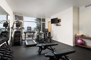 A gym with treadmills, weight machines, and dumbbells. - 🌲Timberline D3E Deluxe 3-Bedroom plus Loft ~Hot Tub~Pool~WiFi~Ski-in/out~Local Shuttle🌲 (Snowmass Village)