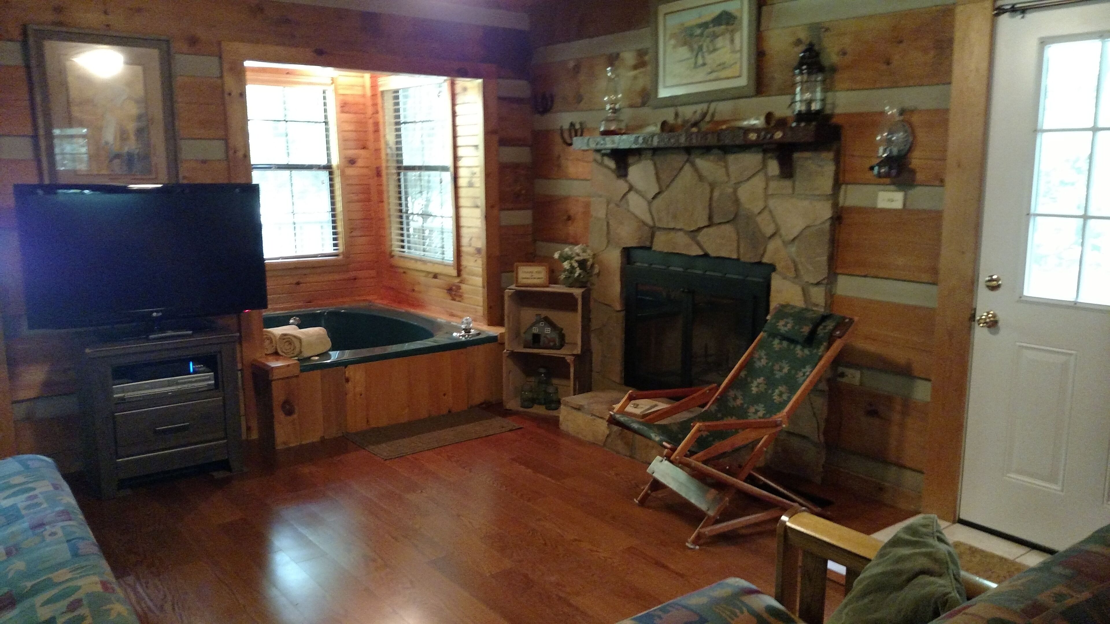 Extremely clean cabin in a quiet setting with an outdoor fire pit. No added fees