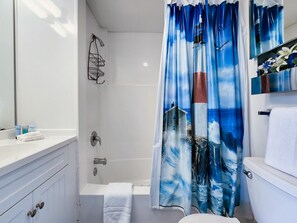 Combined shower/bathtub, towels, soap, shampoo