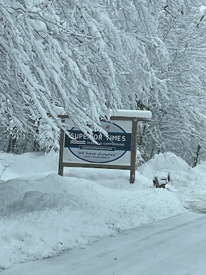 Welcome to Superior Pines Resort & Campground, nestled among snow-covered trees.