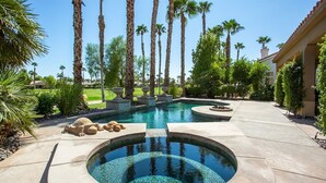 A circular hot tub with a mosaic bottom, surrounded by a stone deck. - 3 Bedroom, PGA West home, Private Pool & Spa, #063306 (La Quinta)
