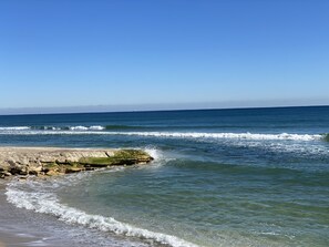 On the beach, sun-loungers, beach towels