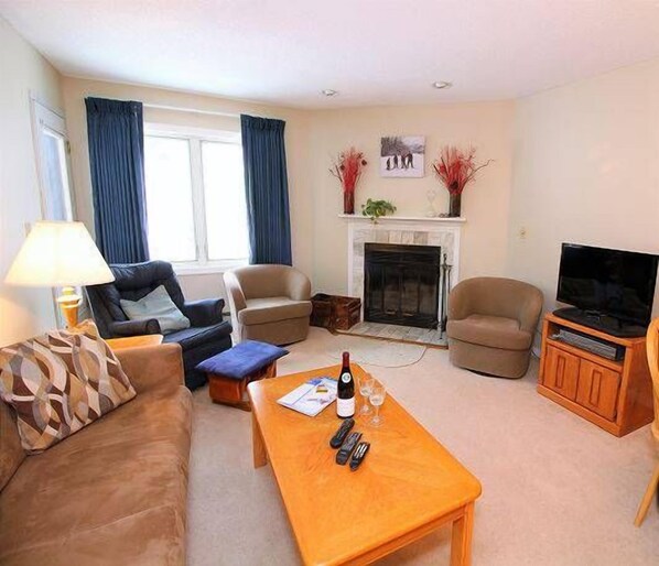 Gather Around the Fireplace - Whether you're watching a movie or warming up after skiing, this comfortable space is made for relaxing.