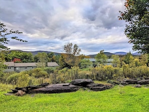 Escape to a serene natural setting surrounded by rolling hills and diverse architecture.