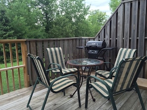 Enjoy al fresco dining on the deck with a grill station and seating for a meal with a view.