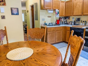 Enjoy cooking and dining in this well-equipped kitchen with a central island and appliances.