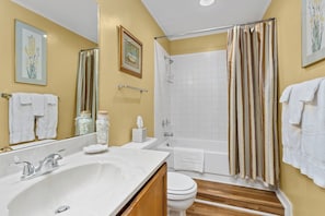 Combined shower/tub, towels, soap, shampoo