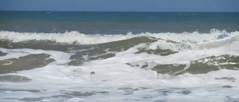 On the beach, sun-loungers, beach towels