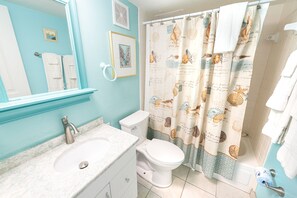 Combined shower/bathtub, hair dryer, towels, soap