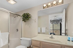 Combined shower/bathtub, towels, soap, shampoo